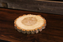Load image into Gallery viewer, Gorgeous handcrafted solid wood modern live edge bark charger. Made in the U.S.A. these chargers are very classy and elegant. Sure to be a conversation piece in any home or cabin. Use these chargers to place plates on to complete your dining table. Not only do they look beautiful but they offer protection from water, food, heat and moisture that could potentially ruin the finish on a table or other piece of furniture.