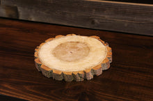 Load image into Gallery viewer, Gorgeous handcrafted solid wood modern live edge bark charger. Made in the U.S.A. these chargers are very classy and elegant. Sure to be a conversation piece in any home or cabin. Use these chargers to place plates on to complete your dining table. Not only do they look beautiful but they offer protection from water, food, heat and moisture that could potentially ruin the finish on a table or other piece of furniture. 
